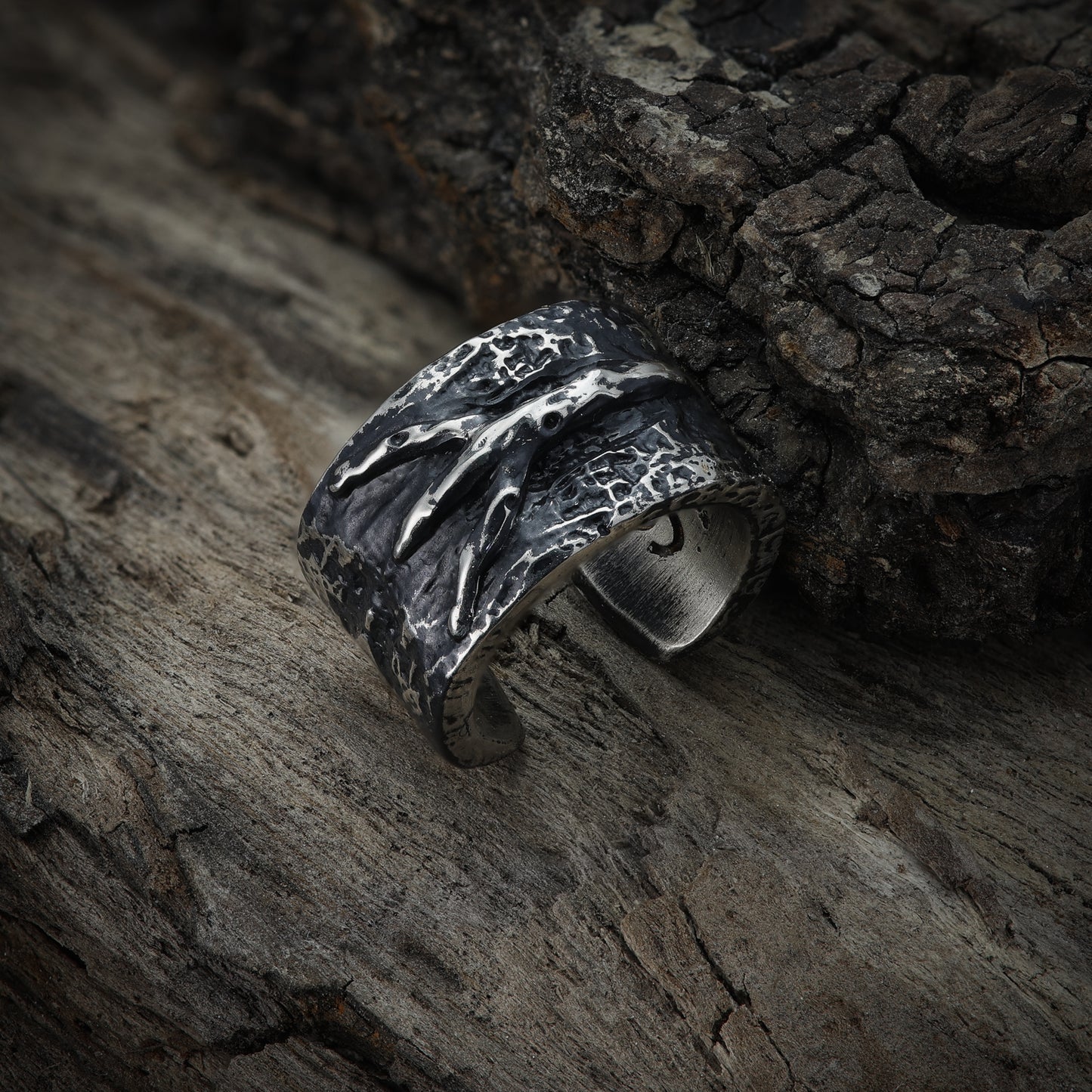 Algiz Rune Ear Cuff - Detailed Carvings: A zoomed-in image highlighting the intricate carvings on the Algiz Rune Ear Cuff, showcasing the fine details and symbolism associated with pagan heritage.