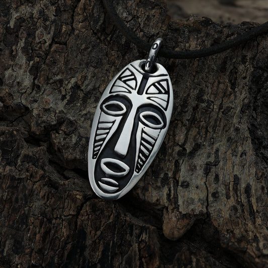 Detailed close-up of the sterling silver Warrior Mask pendant showcasing intricate design.