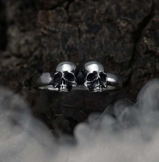 Top view of sterling silver double skull ring.