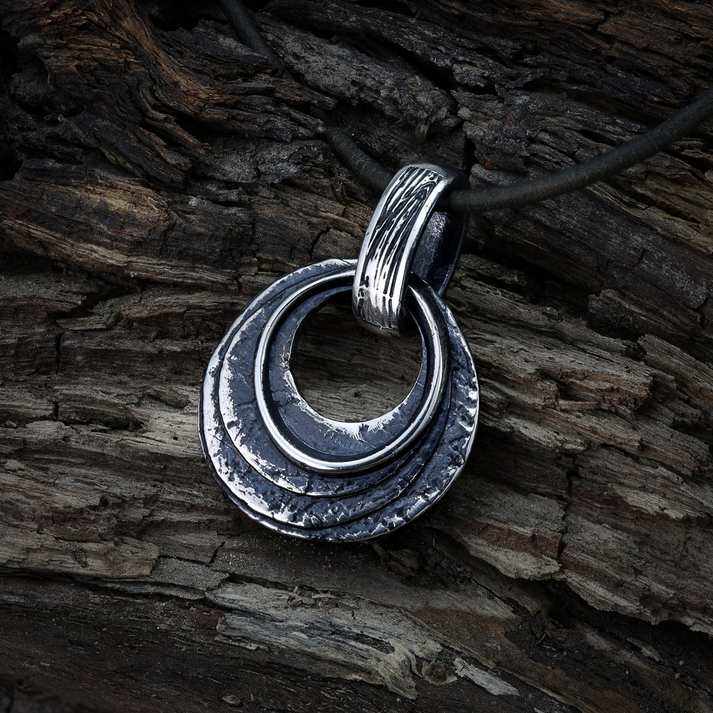 Pagan round talisman, sterling silver with Norse motifs.