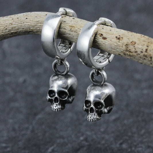Chunky skull hoop earrings.