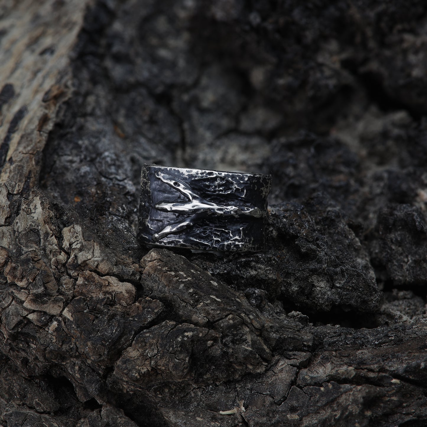 Algiz Rune Ear Cuff - Natural Lighting: A beautifully lit photograph of the Algiz Rune Ear Cuff, capturing the interplay of light and shadows on the sterling silver surface, enhancing its pagan-inspired design.