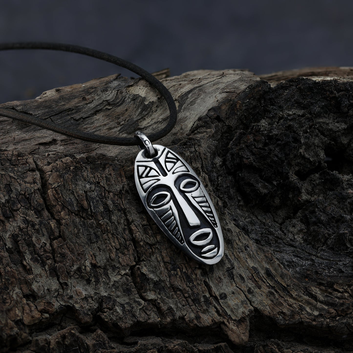 Warrior Mask sterling silver pendant on leather cord, symbolizing strength and courage