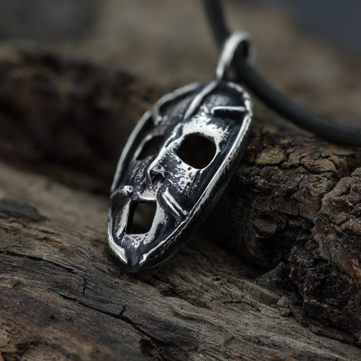 Side profile of the 'Prison of the Mind' pendant, illustrating the pendant's depth and craftsmanship