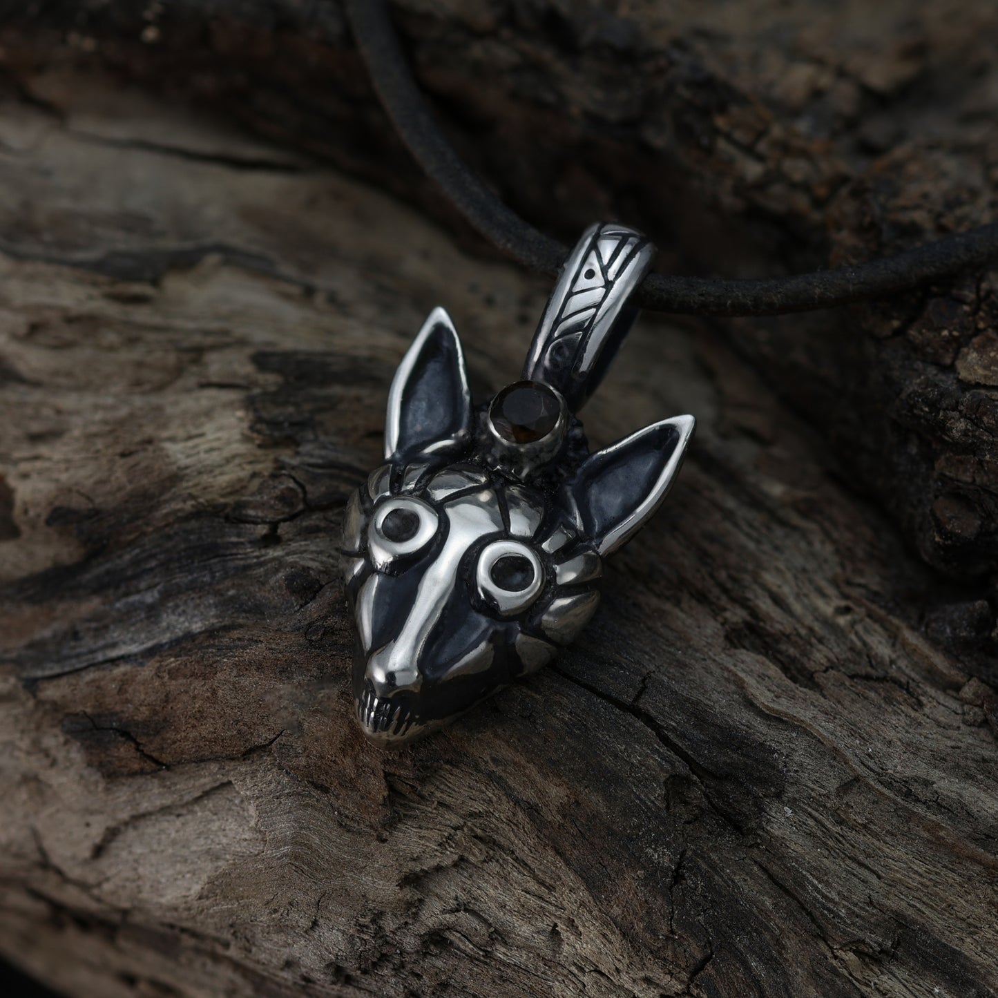 Top-down view of the fox pendant revealing depth and carving details.