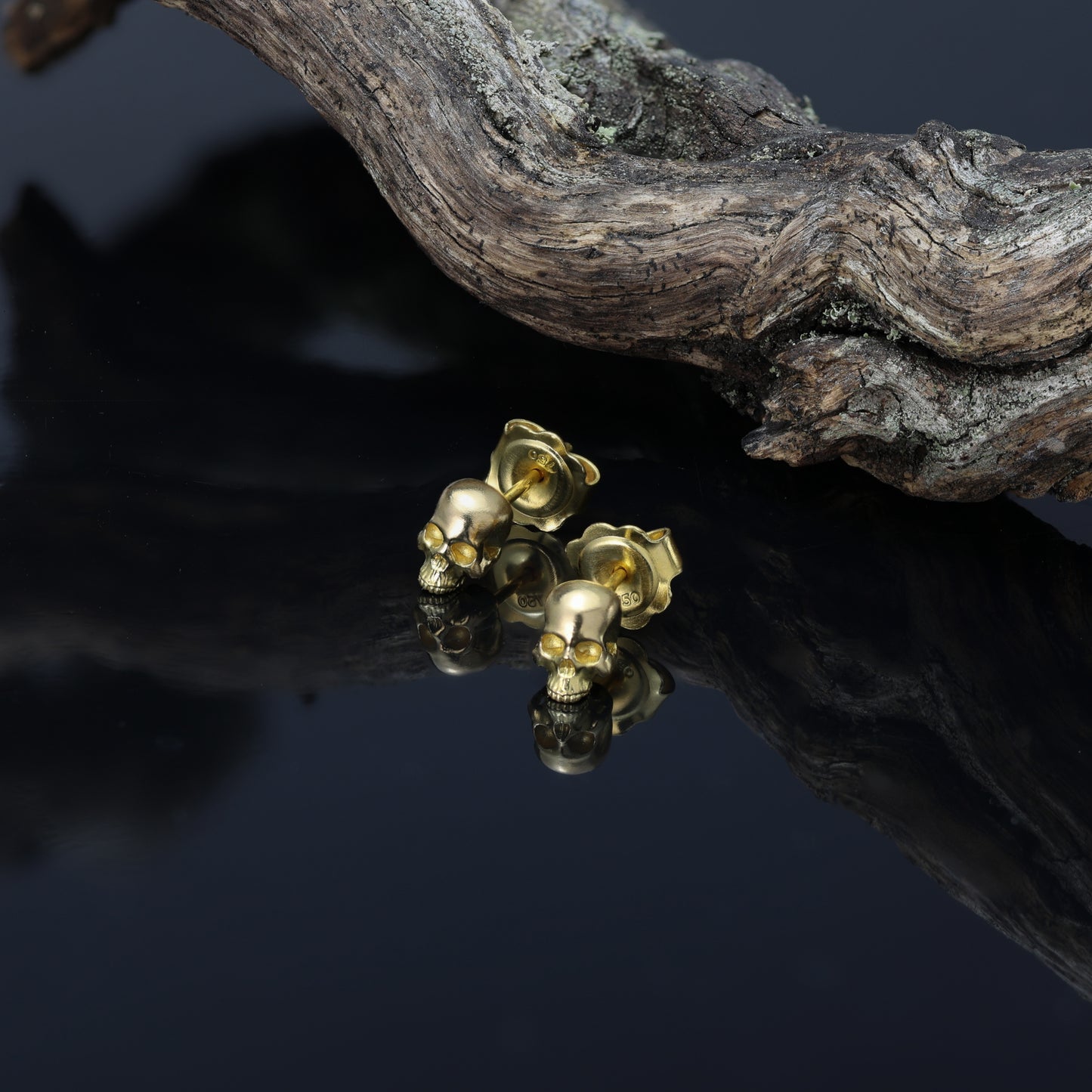 Handcrafted gold skull earring suitable for any occasion.