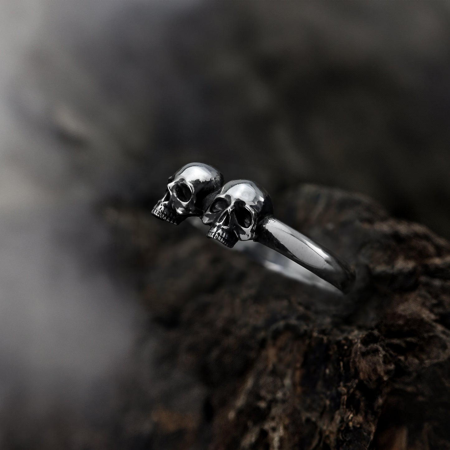 Close-up of sterling silver double skull band details.