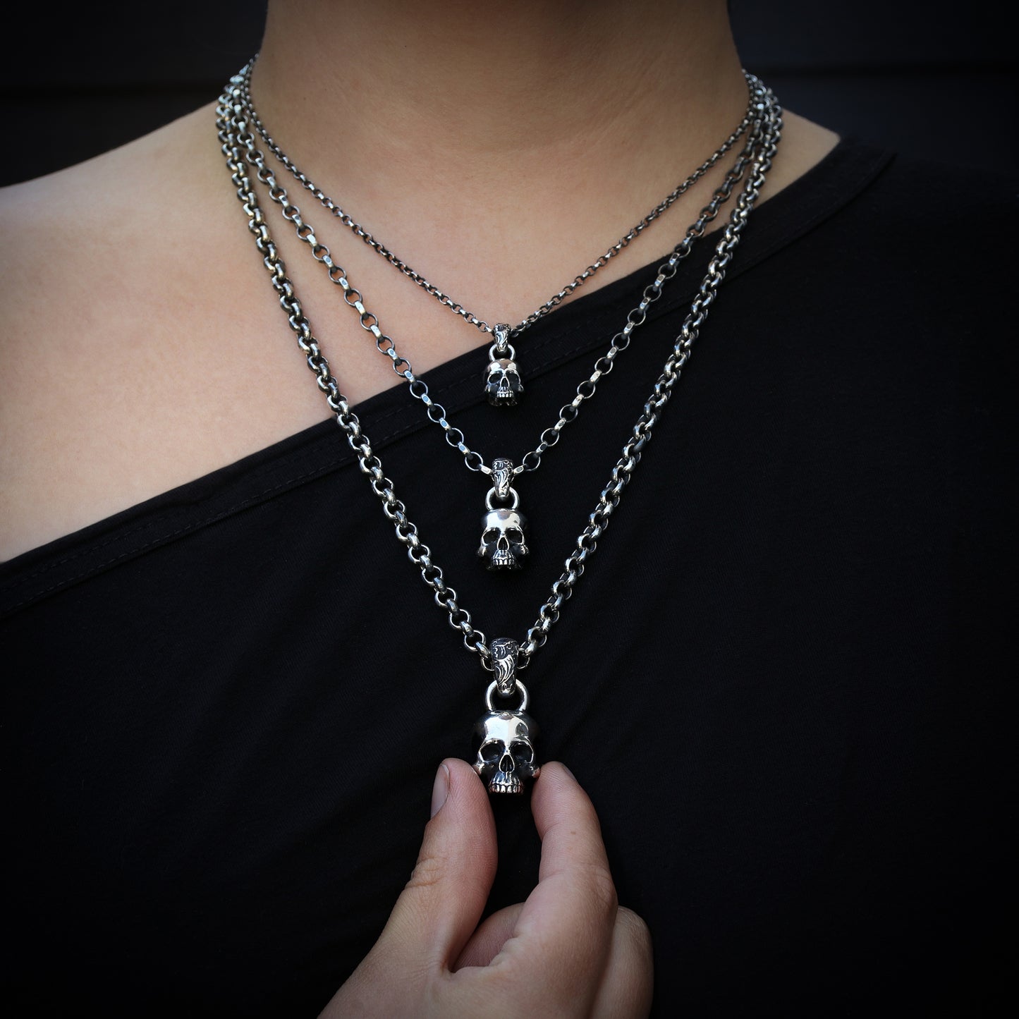 Sterling Silver Skull Pendant worn by a model.