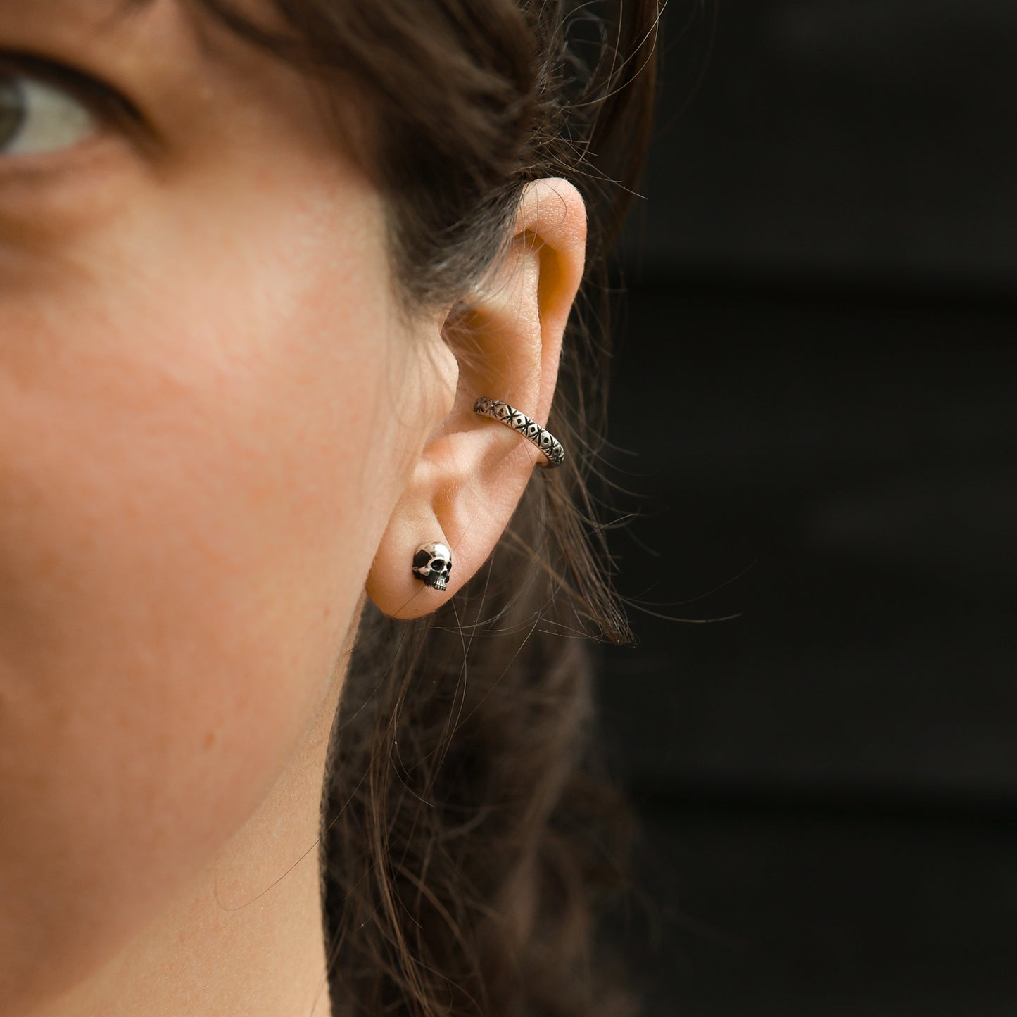 Side profile of the skull earring showcasing its depth.