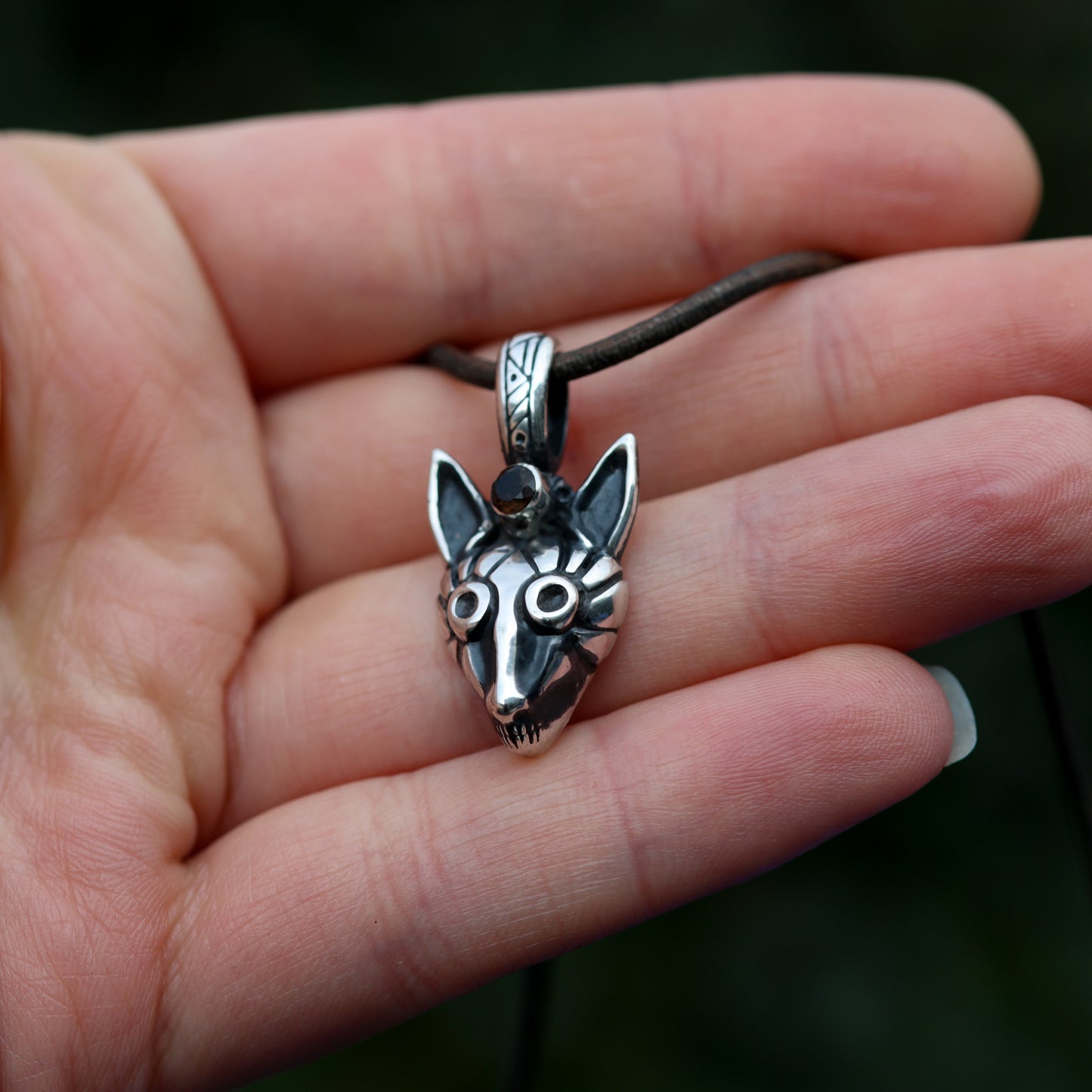 Side profile of the Sterling Silver Fox Pendant showcasing its thickness.