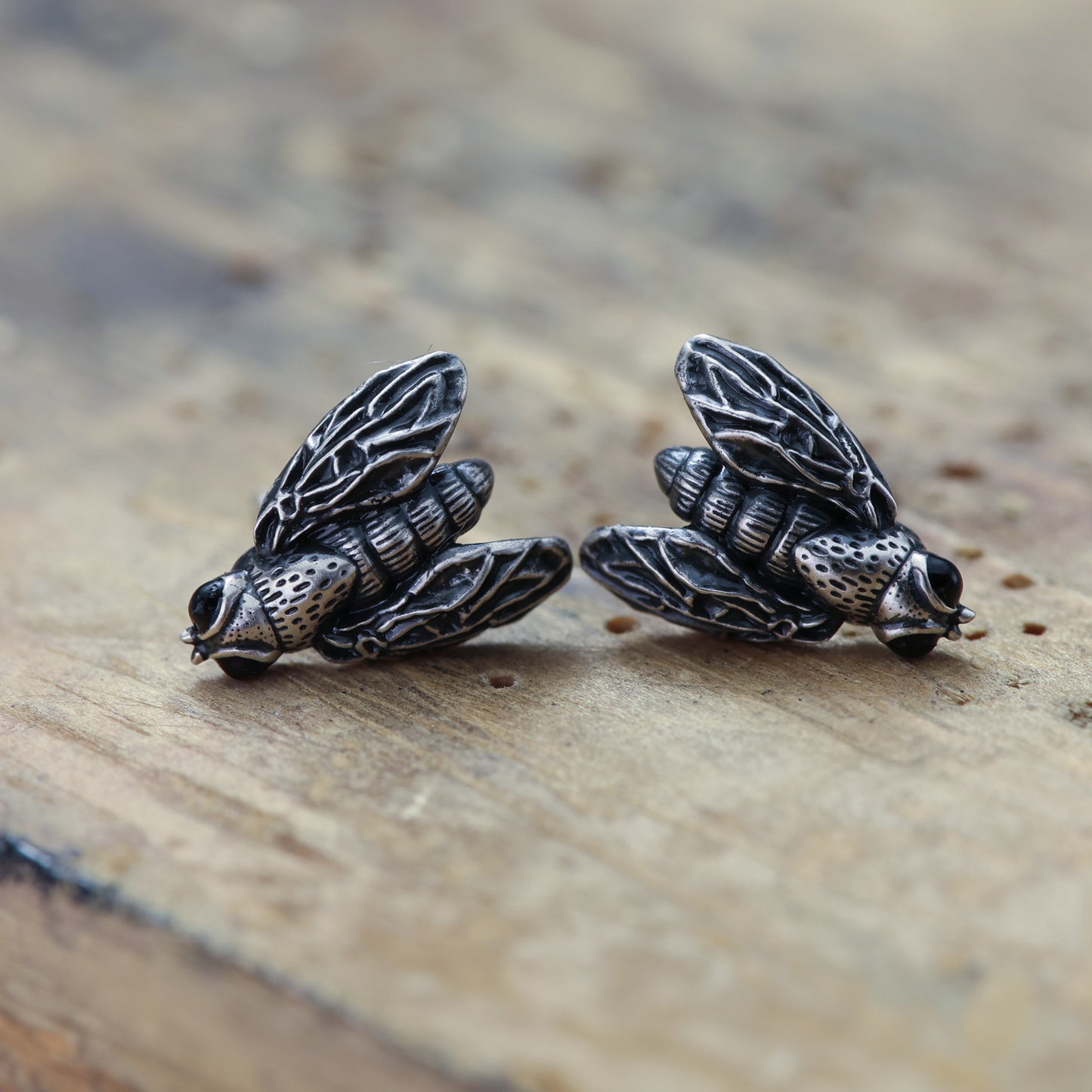 Unique and quirky sterling silver earrings resembling flies.