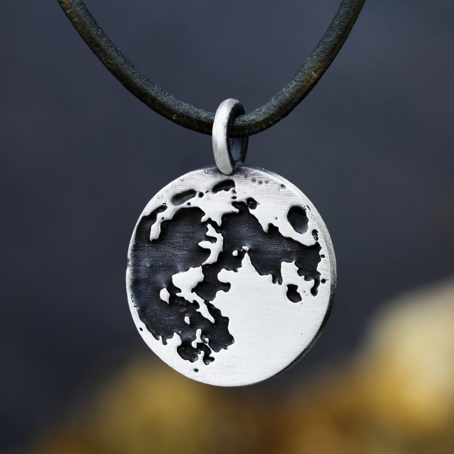 moon pendant on leather cord