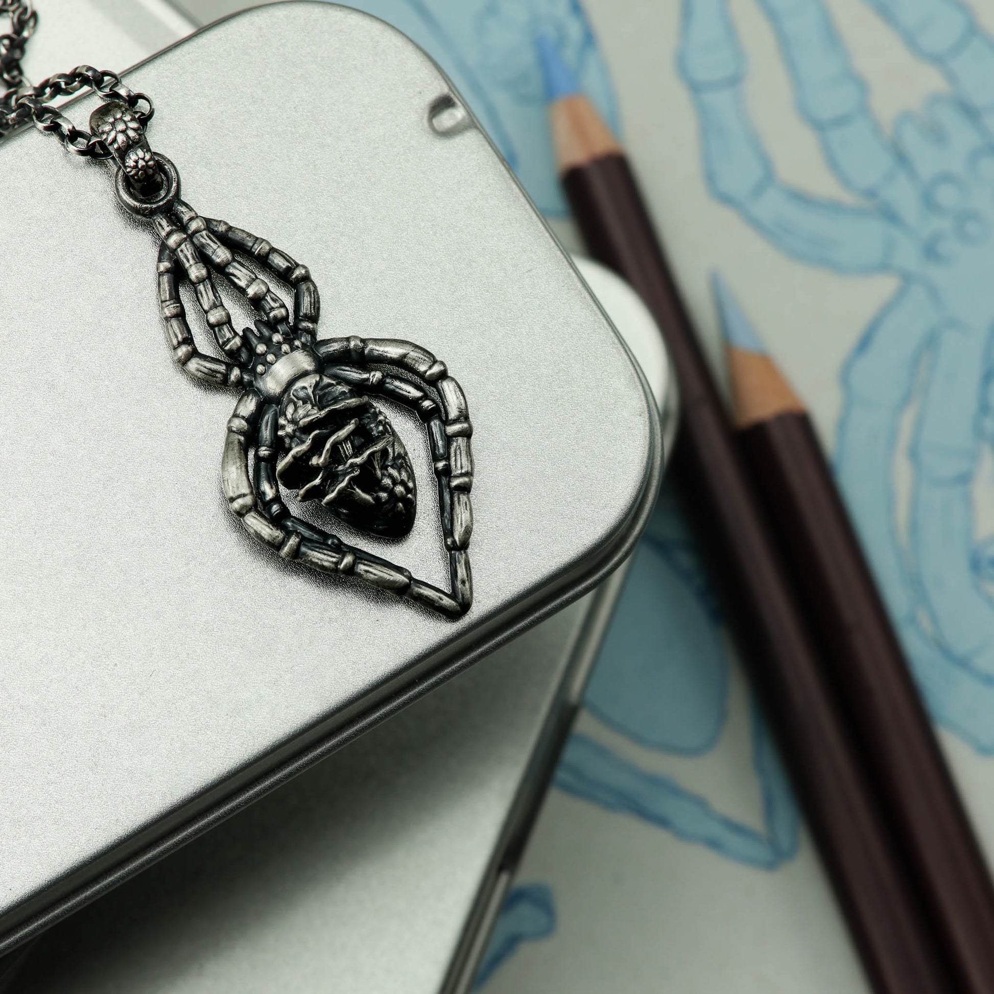 A whimsical and elegant sterling silver spider pendant, with intricate details inspired by the forest and its inhabitants, ideal for anyone who loves mushrooms, witchcraft, and all things enchanting.