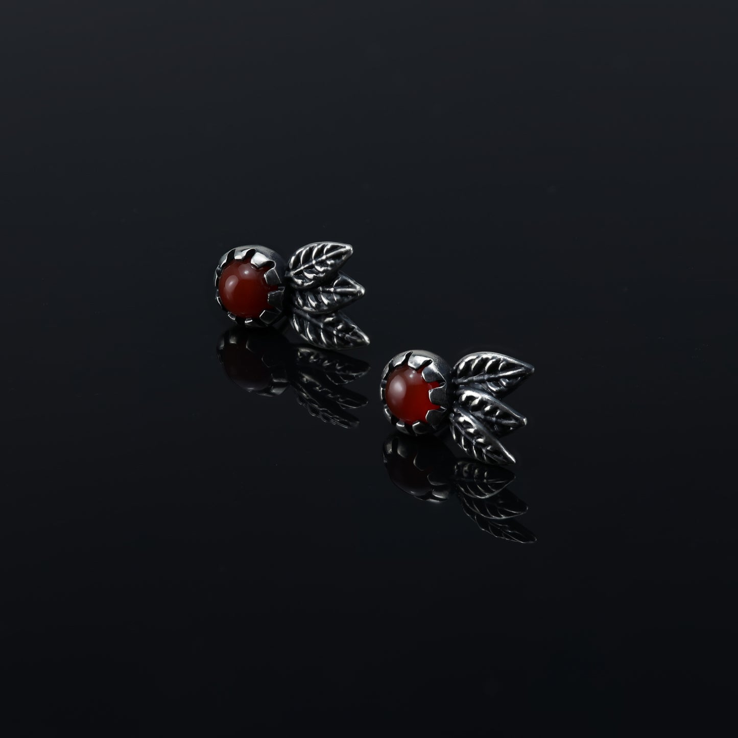 Carnelian gemstone stud earrings with delicate sterling silver leaves