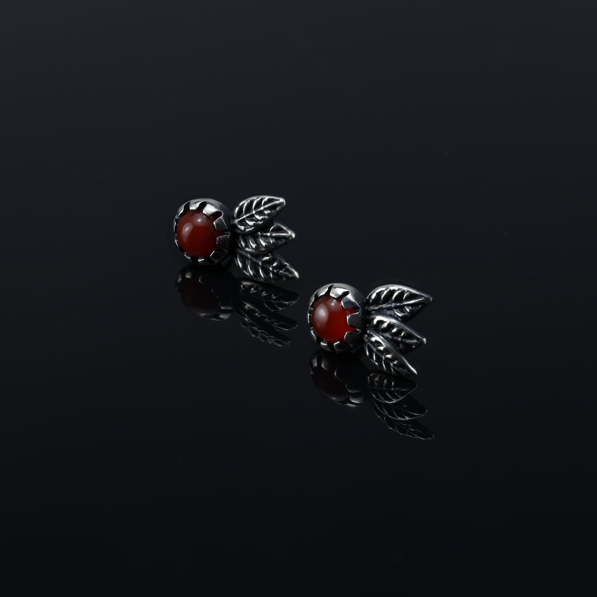 Carnelian gemstone stud earrings with delicate sterling silver leaves