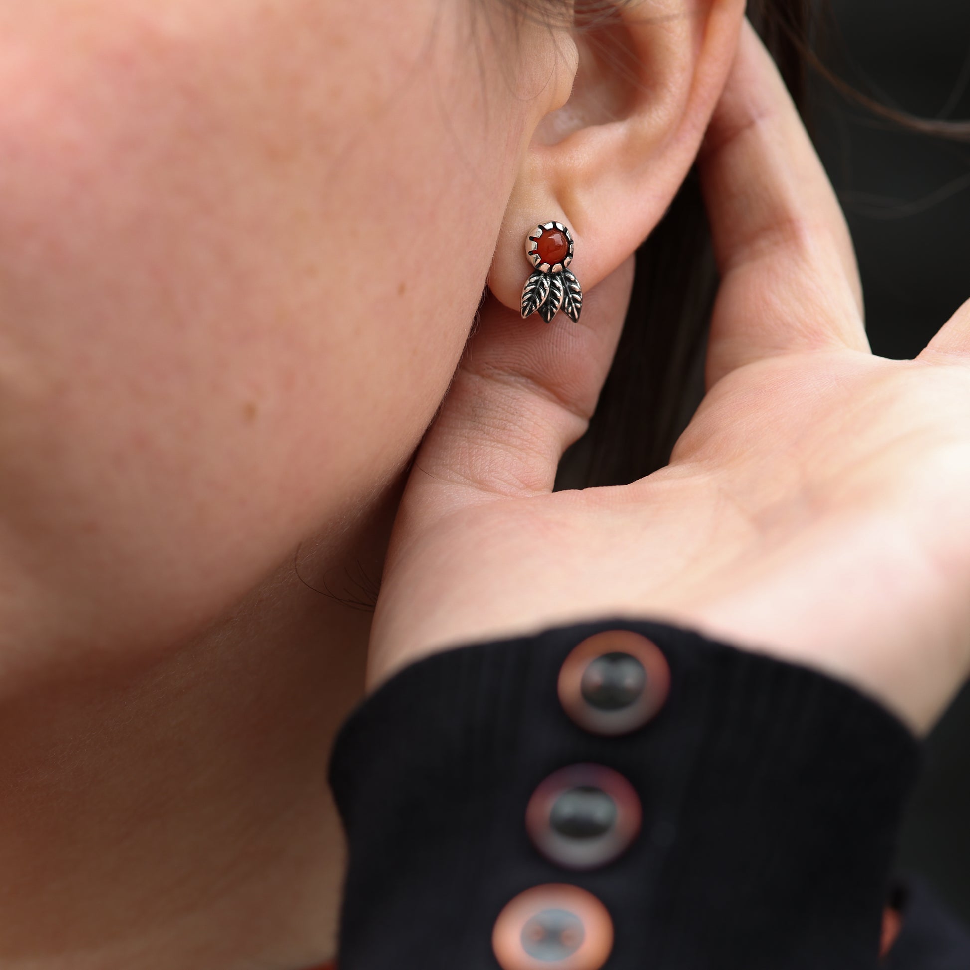 Scottish-made sterling silver earrings with vibrant carnelian gemstones and nature motif