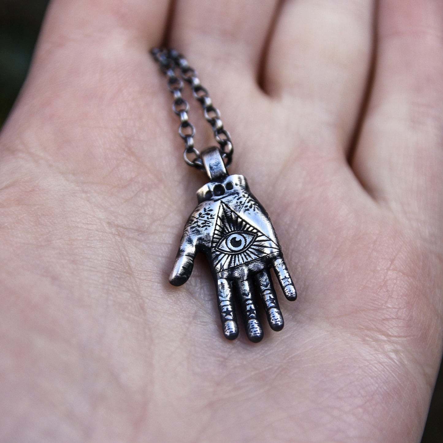 Palmistry hand necklace.