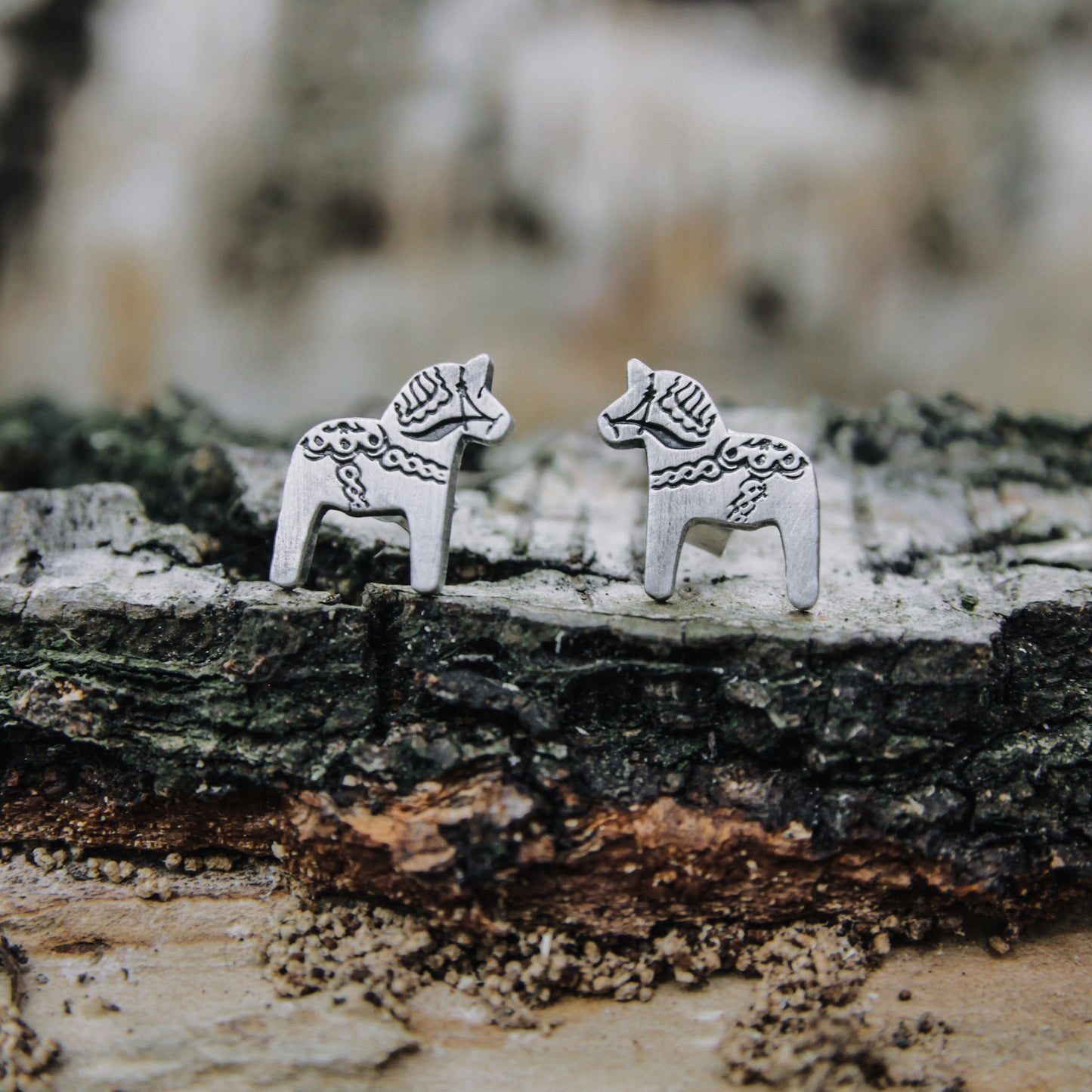 Dala horse stud earrings.